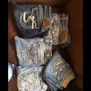 Two miss me jeans and three silver boot cut jeans